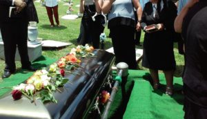 A family attending a funeral of a wrongful death victim. The family may pursue a wrongful death claim.